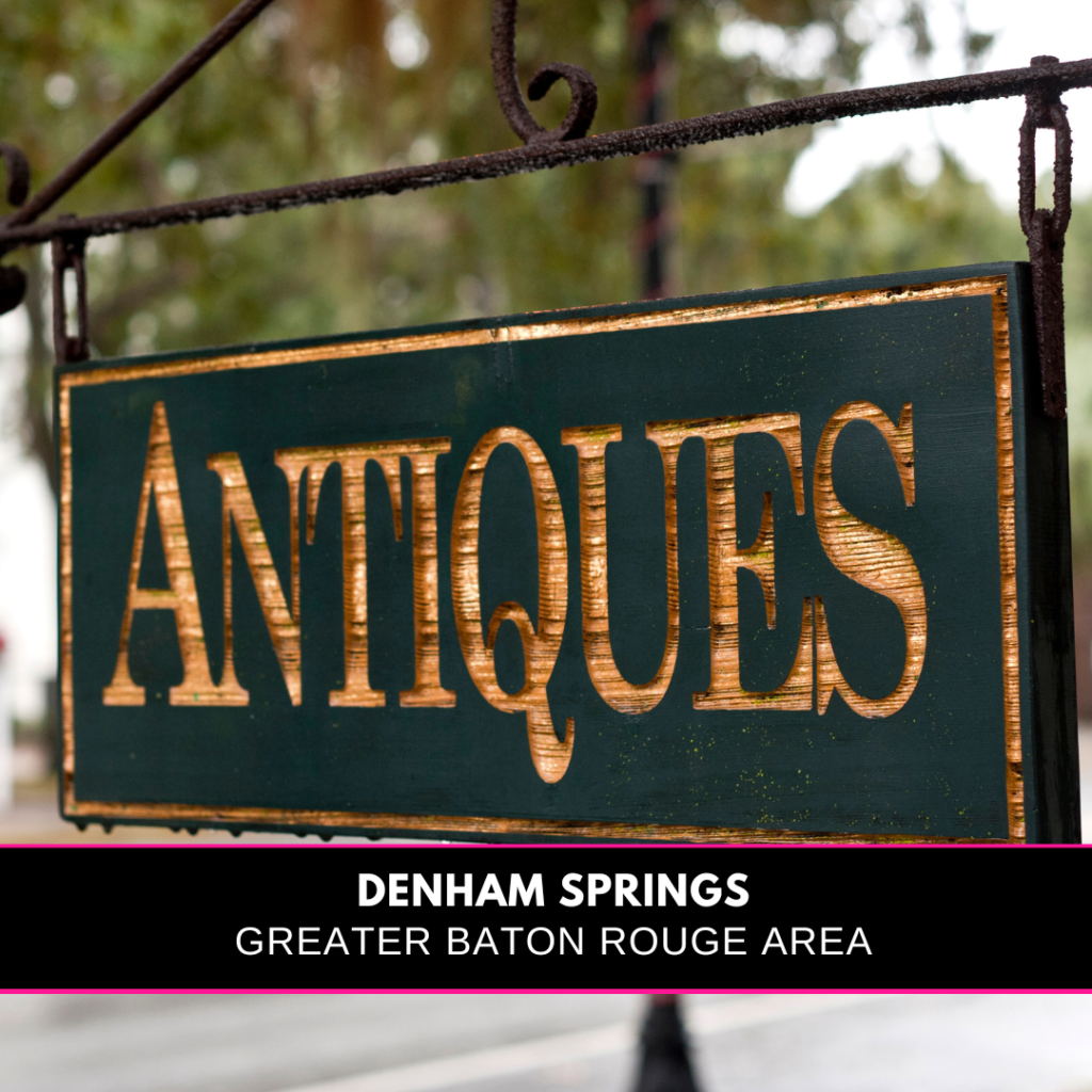 a hanging sign wih the word antiques and the title Denham Springs