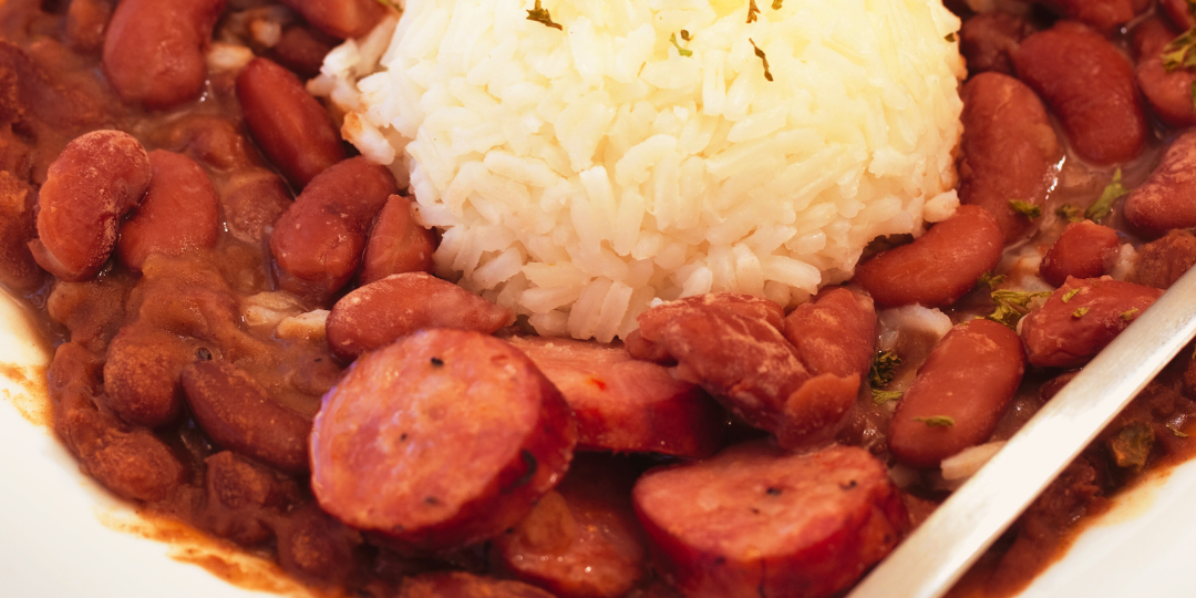 A bowl of red beans and rice and a banner reading Greater Baton Rouge Food Banks