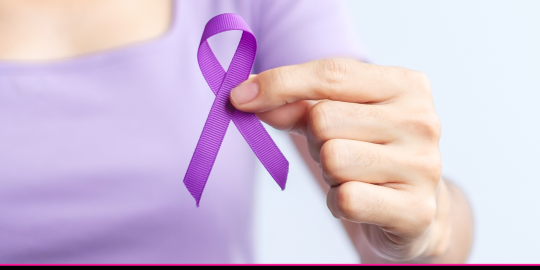 a Woman in a purple shirt holding a purple ribbon and a banner that reads Greater New Orleans Area Domestic Violence Resources