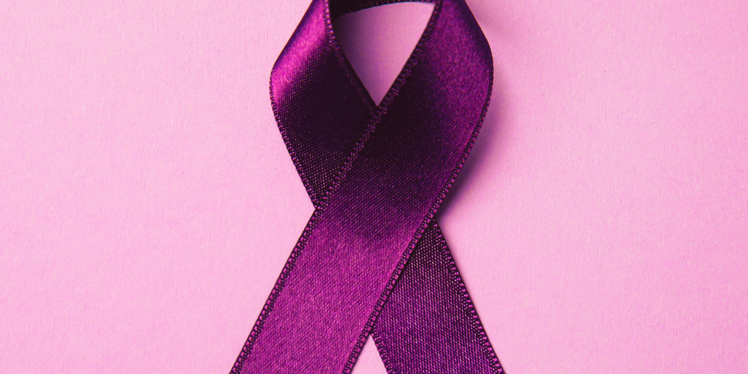 A purple ribbon and a banner that reads Acadiana Area Domestic Violence Resources